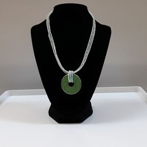 Necklace, beaded and large green charm